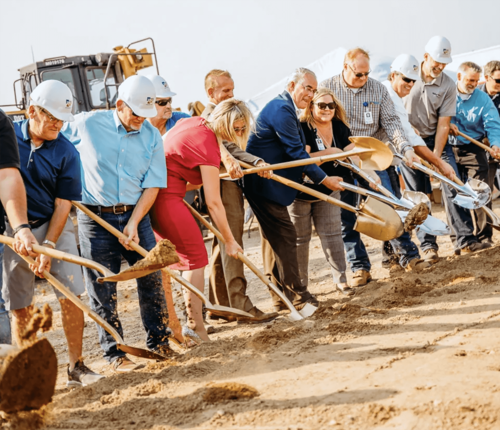Engineers reviewing plans on an active construction site